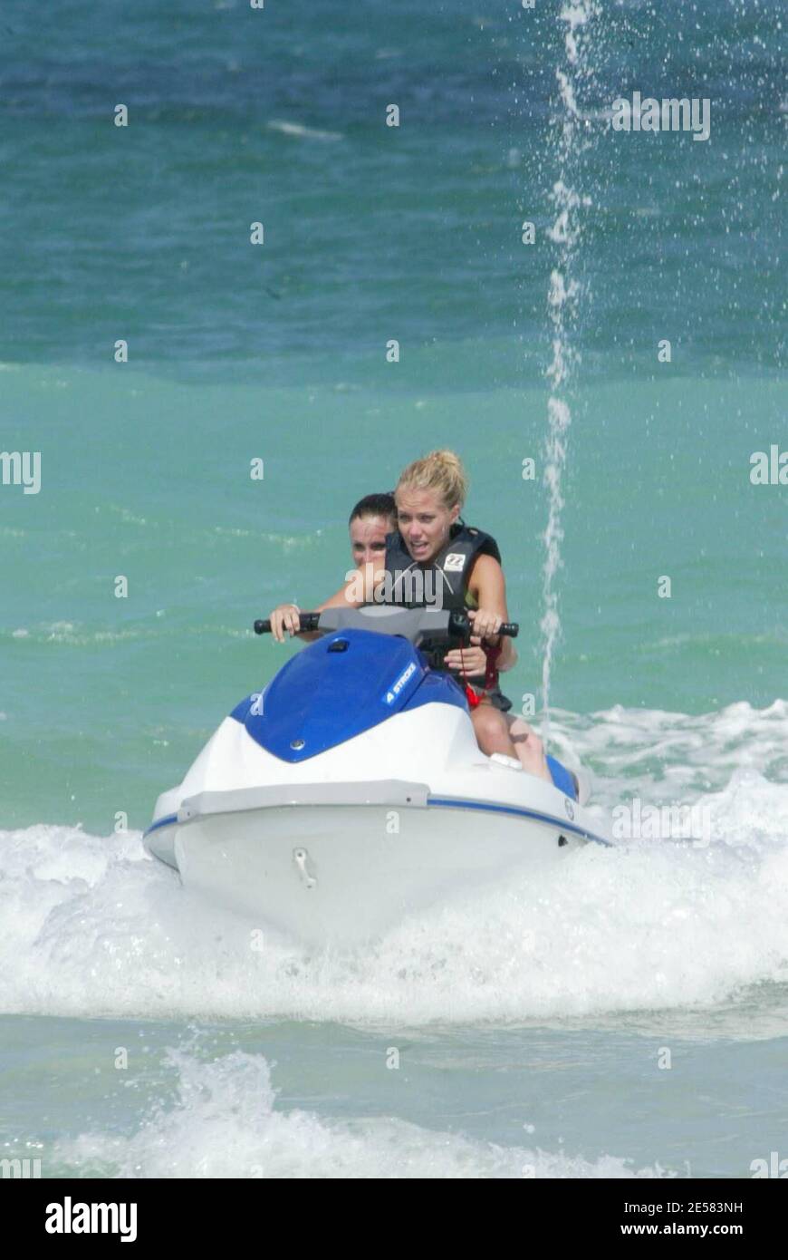 Exclusive!! Playboy Playmate and girlfriend of Hugh Hefner Kendra Wilkinson goes Jetsking and parasailing with a pal on Saturday afternoon on Miami Beach, FL, 5/5/07.    [[mab]] Stock Photo