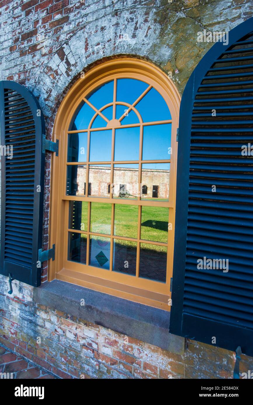 Restored windows at Fort Macon reflect the inner court known as the parade ground at Fort Macon State Park in Atlantic Beach, NC. Fort Macon was const Stock Photo