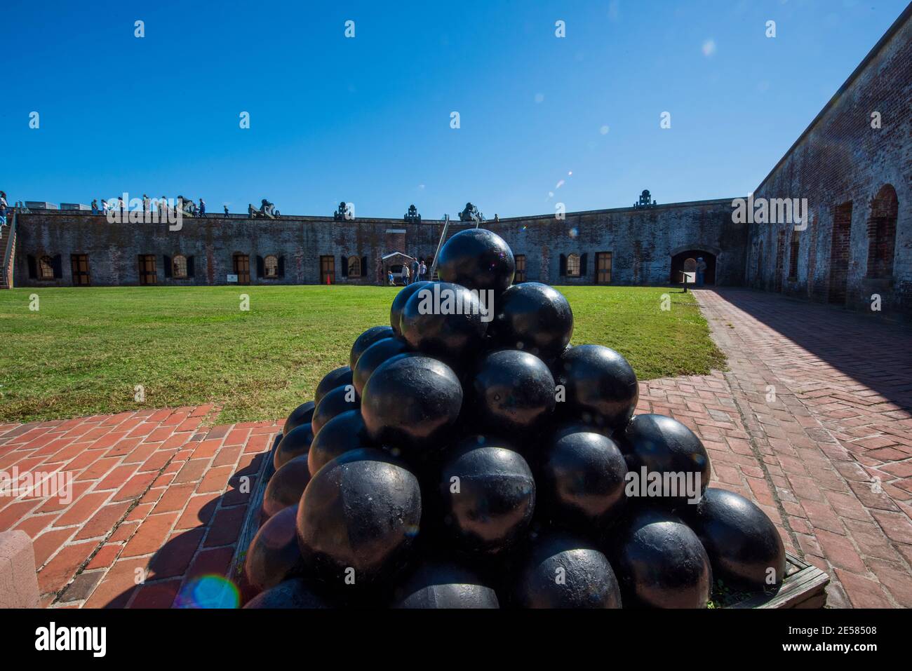 A pyramid of cannonballs at Fort Macon State Park in Atlantic Beach, NC. Fort Macon was constructed after the War of 1812 to defend Beaufort Harbor. T Stock Photo