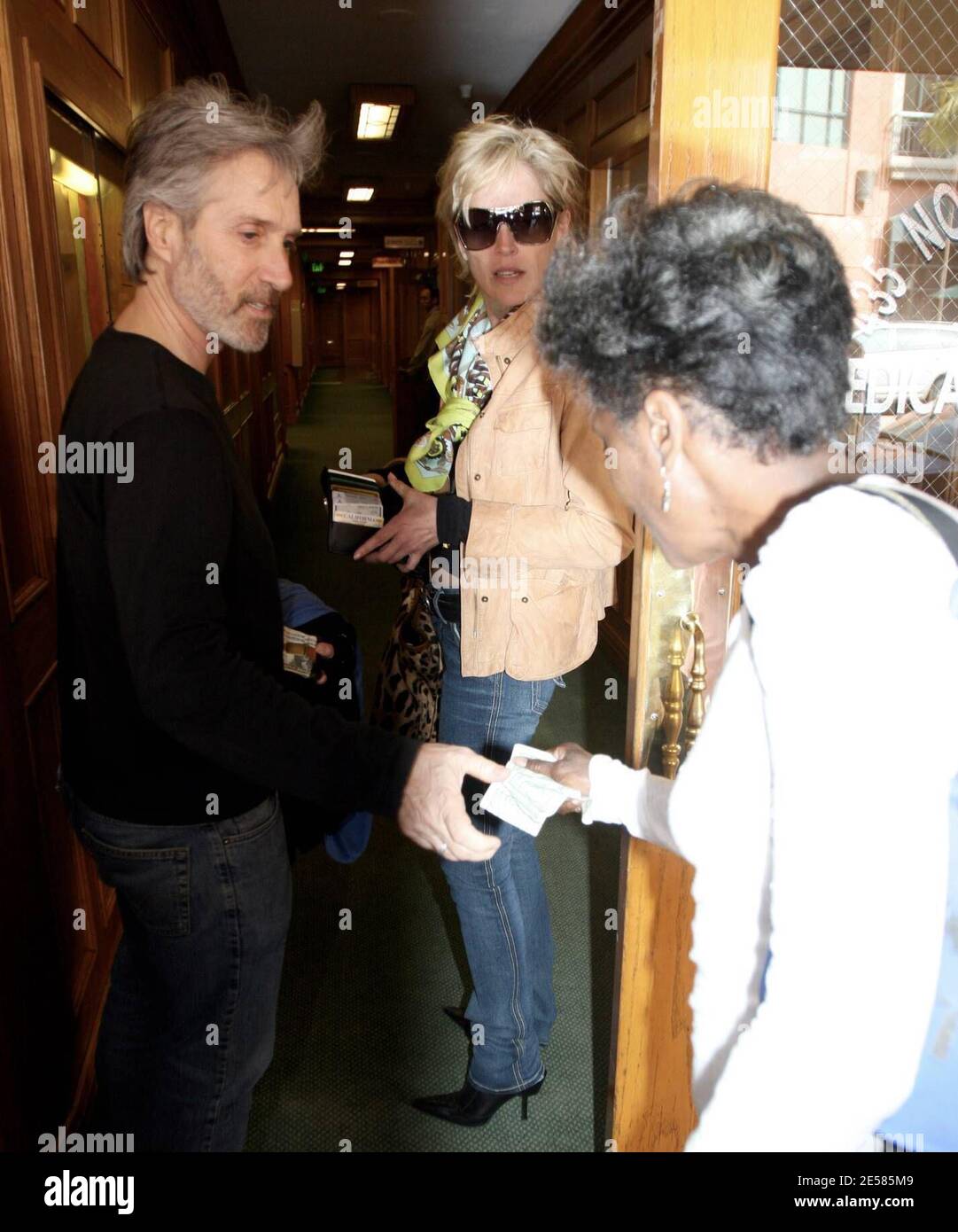 A perky Sharon Stone and her new beau shop and stroll in Beverly Hills, Calif. The couple were smiling and laughing the entire time as crowds of curious shoppers gathered round. Pit stops included the Dior store and a medical building where Sharon gave a donation to a homeless lady. 5/16/07.  [[rac ral]] Stock Photo