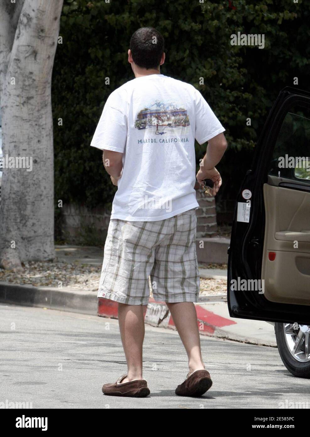 Exclusive!! Adam Sandler steps out with his daughter, Sadie Madison, who  just turned one year old this month. Sandler was sporting a pair of  slippers, shorts and a Malibu t-shirt. Los Angeles,
