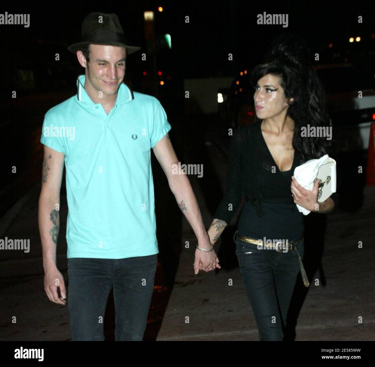 Exclusive!! Newlyweds UK jazz pixie Amy Winehouse and hubby Blake Fielder-Civil take a stroll hand-in-hand on their wedding night in Miami Beach, Fla. 5/18/07.   [[mab]] Stock Photo