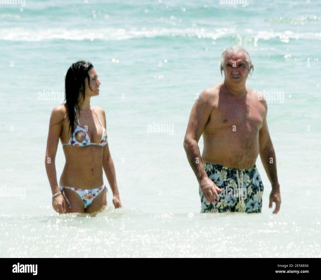 Exclusive!! Formula One Renault Boss Flavio Briatore and model girlfriend  Elisabetta Gregoraci get playful on a recent trip to Florida. The pair got  hot and heavy under the sun on Miami Beach