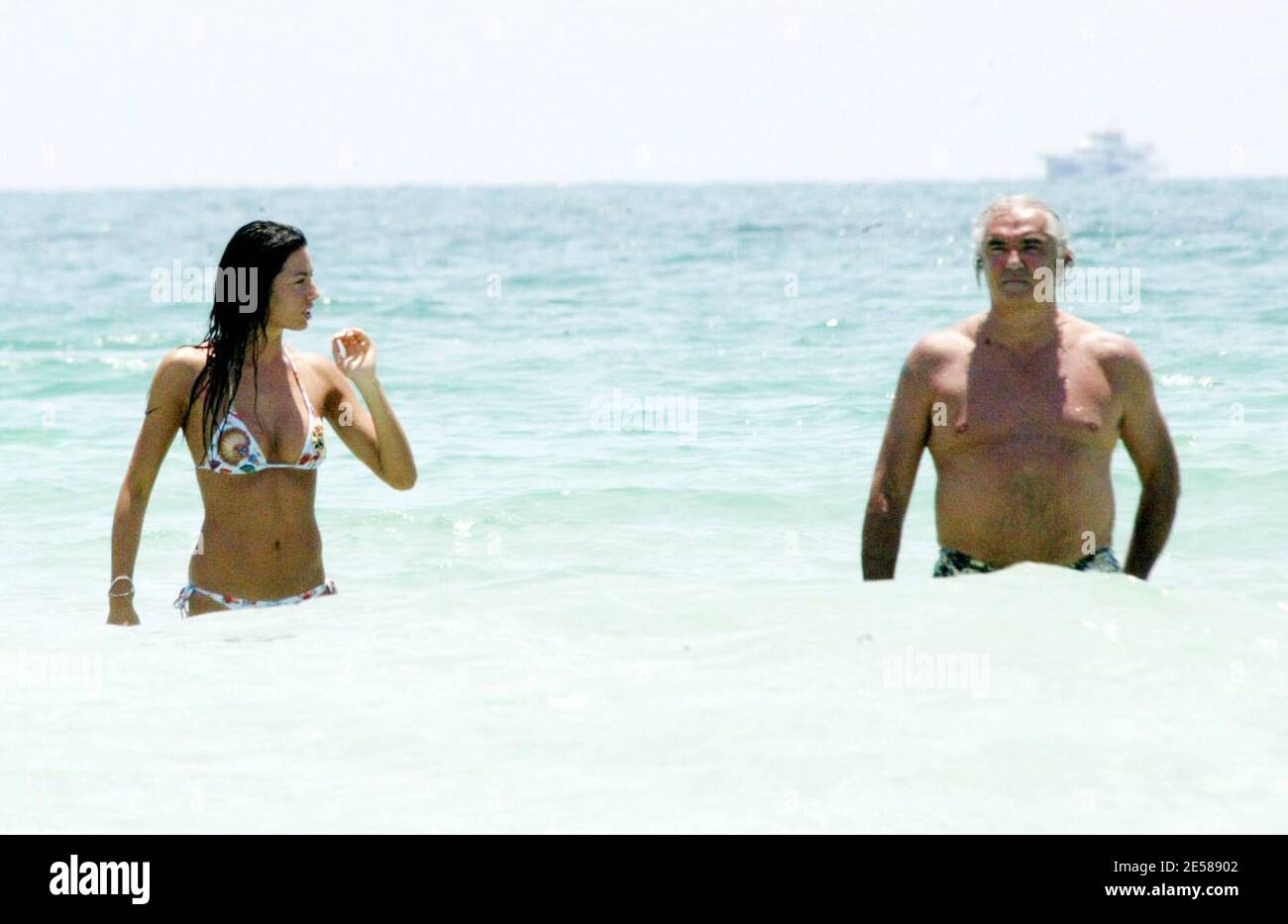 Exclusive!! Formula One Renault Boss Flavio Briatore and model girlfriend Elisabetta Gregoraci get playful on a recent trip to Florida. The pair got hot and heavy under the sun on Miami Beach and cooled off in the Ocean before returning to their hotel. Miami, Fla. 6/12/07. [[mab]] Stock Photo