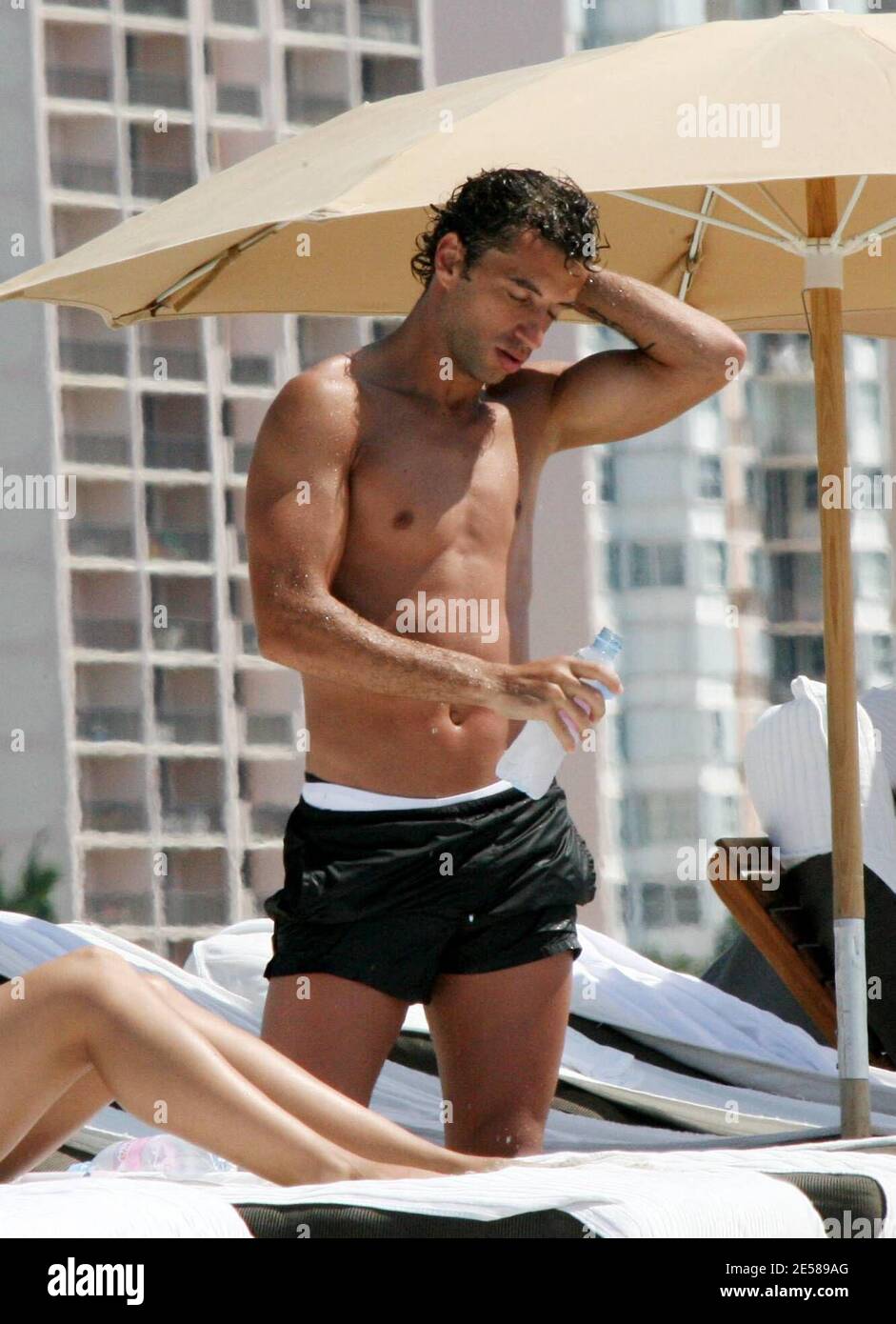 Exclusive!! Portuguese footballers Simao Sabrosa and Bruno Jo†o Morais Aguiar enjoy time in the sun with friends on Miami Beach, Fla. 6/14/07.   [[tag mab]] Stock Photo