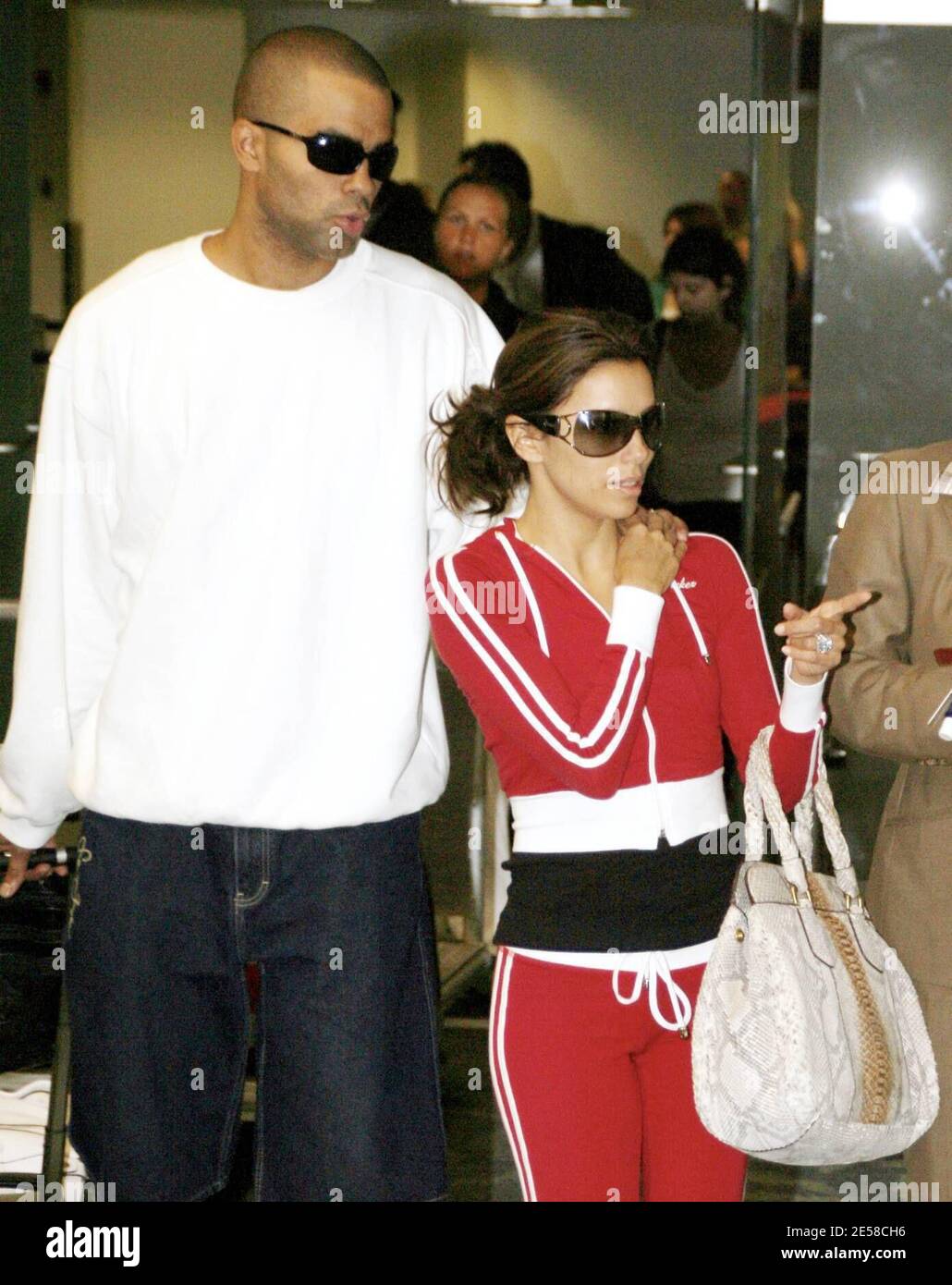 Exclusive!! Meet Mr. and Mrs. Parker! Eva Longoria and new hubby Tony Parker  arrive Stateside after thier European wedding in France. The couple made  their way through international arrivals before flying off