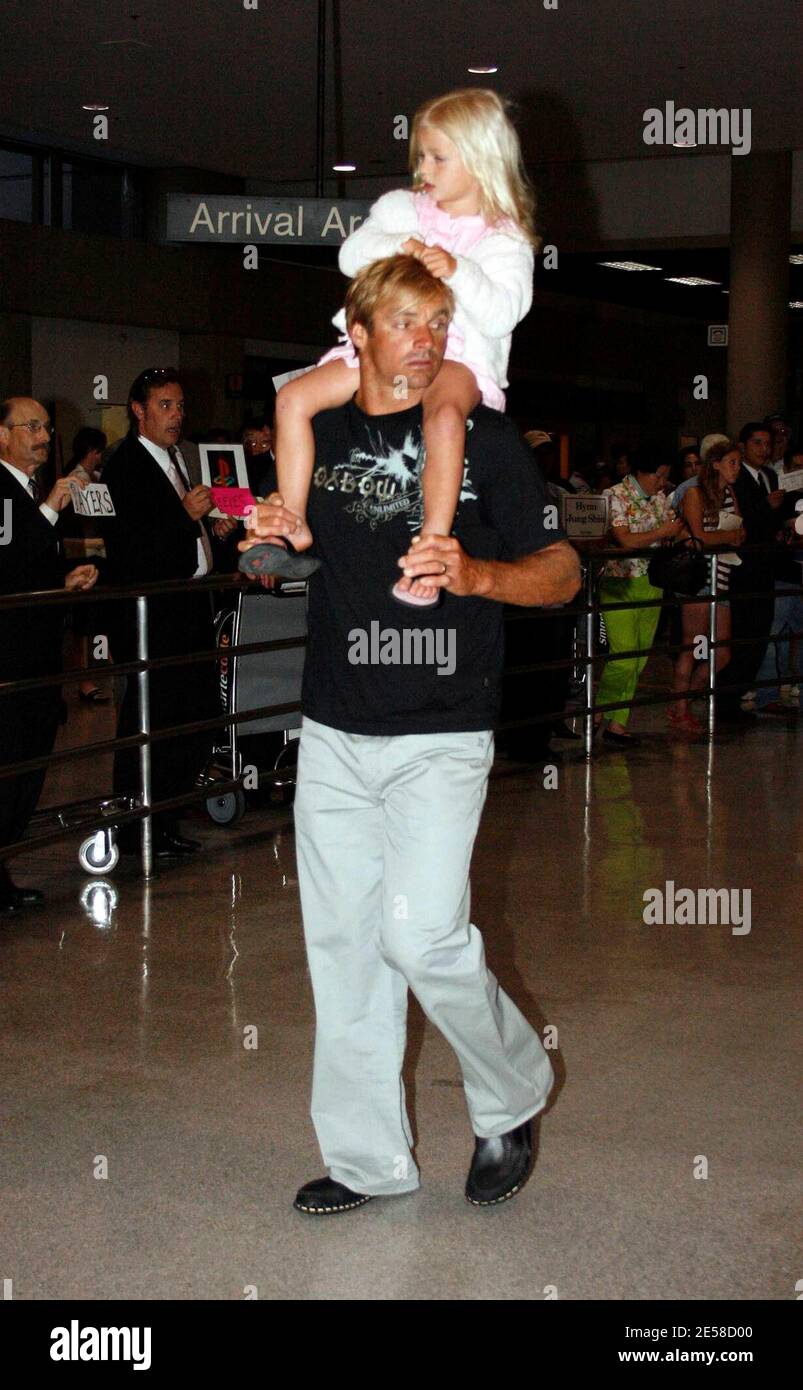 Exclusive!! Laird Hamilton, daughter Reece and wife Gabrielle Reece arrive at LAX airport. Los Angeles, Calif. 7/12/07.   [[wam]] Stock Photo