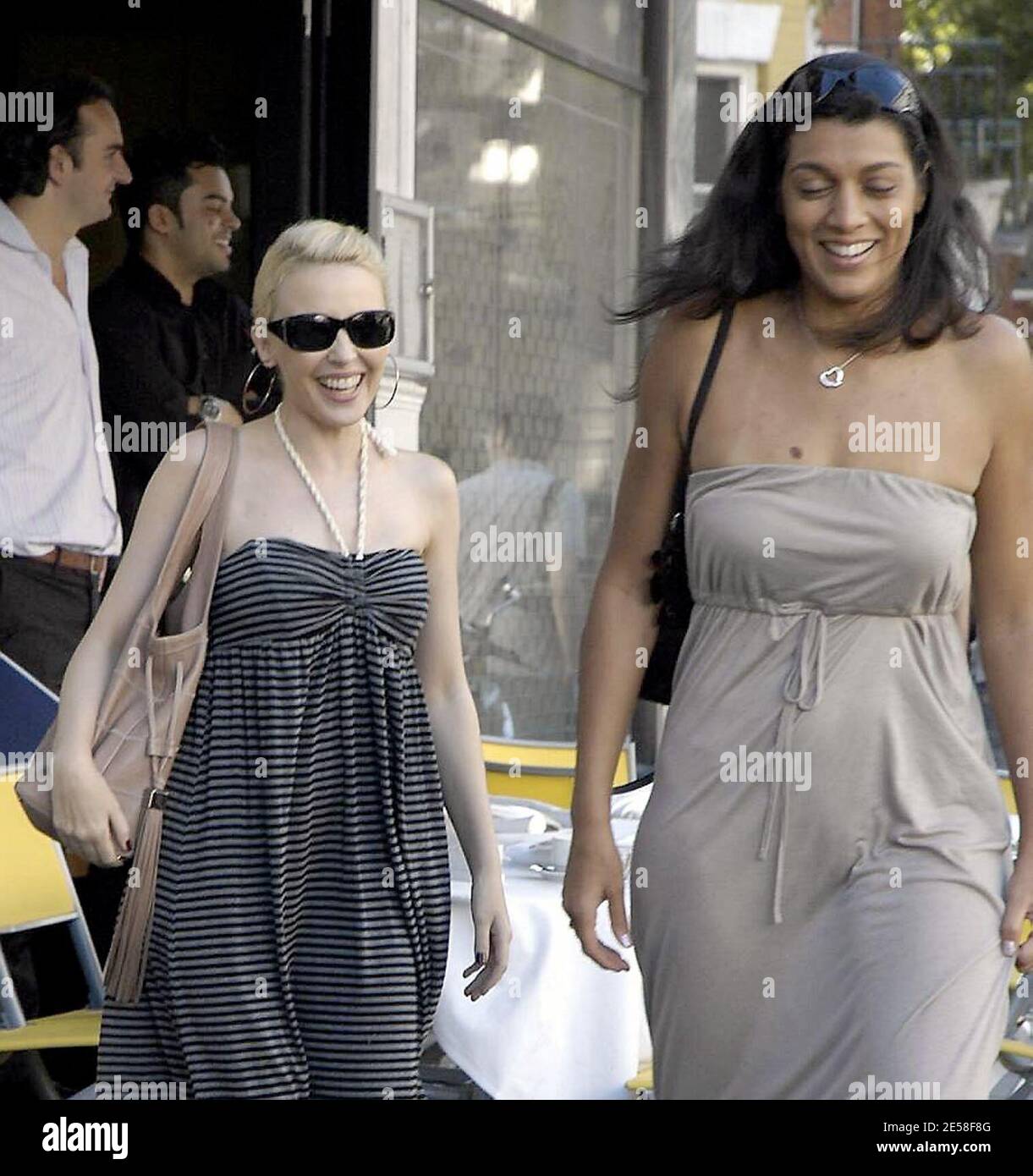 Kylie Minogue leaves her London home and stops into the nearby Cambio De Tercio cafe with a friend for lunch. Kylie threw a party to celebrate 20 years of success following her first hit single 'Locomotion.' London, UK. 8/4/07. [[map]] Stock Photo