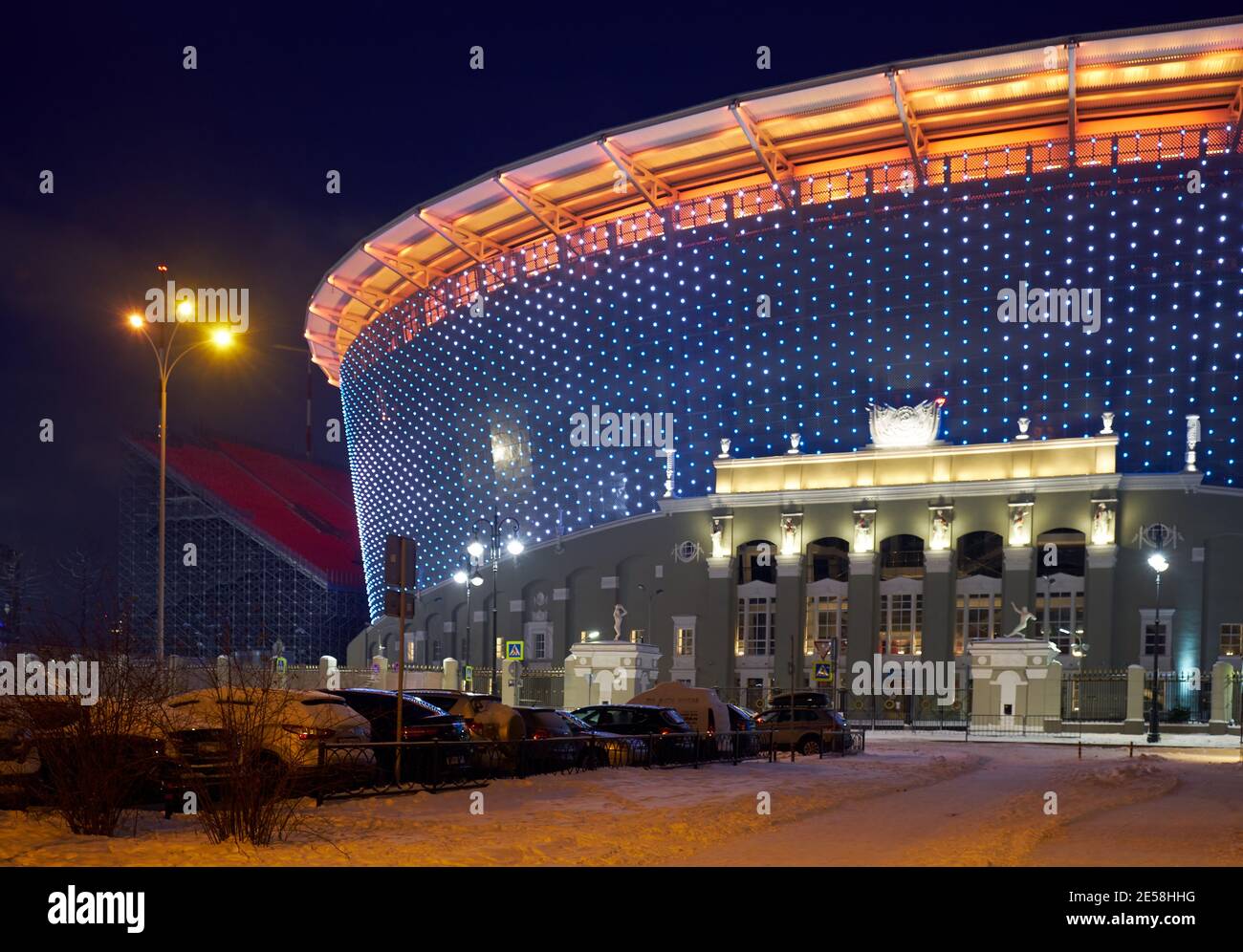 Yekaterinburg, Russia – January 03, 2021: The night view of brightly illuminated Ekaterinburg Arena (Central Stadium) from the side of classical porti Stock Photo