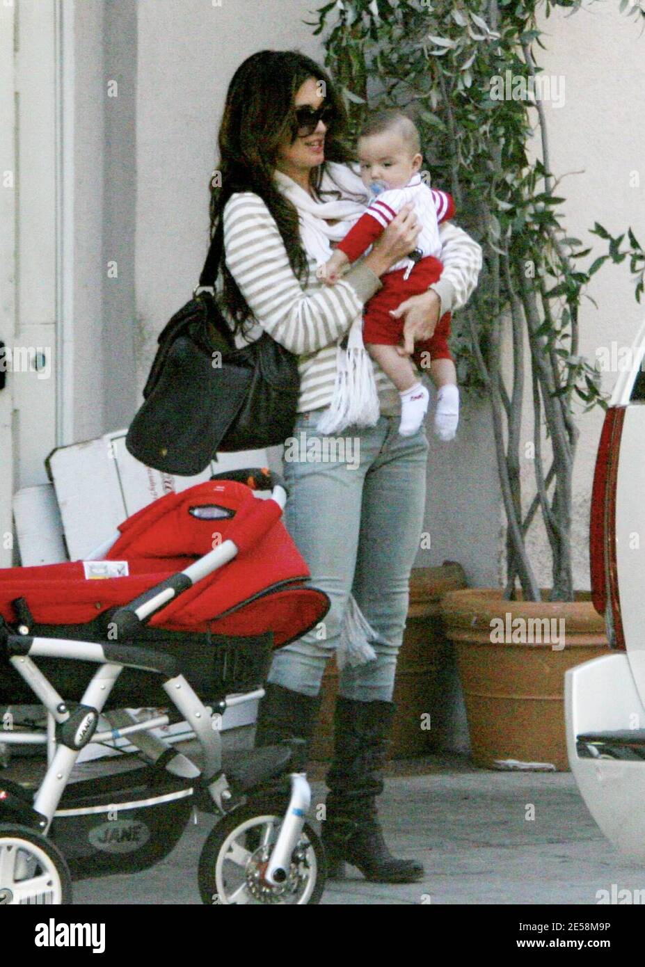Exclusive!! Actress Paz Vega, husband Orson Salazar and four month old son Orson share a family day out. The proud new parents played with their son over lunch and took lots of photos to capture the moment. Little Orson was full of smiles and giggles. They were joined by an older woman who appeared to be Paz's mother (check). Beverly Hills, Calif. 9/16/07.    [[rac ral]] Stock Photo