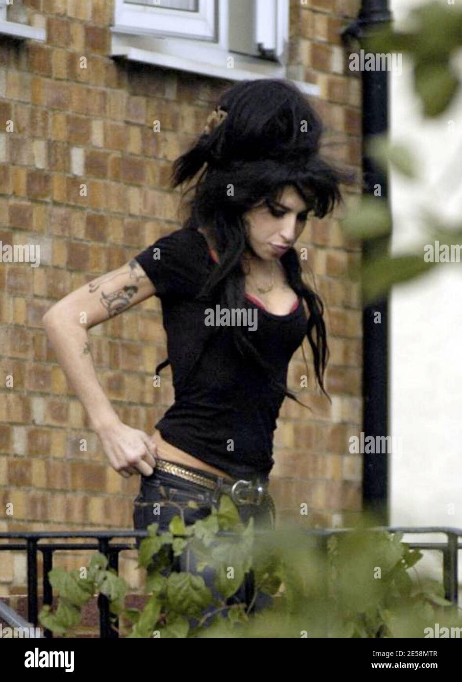 Amy Winehouse And Blake Fielder-civil Outside Their North London Home 