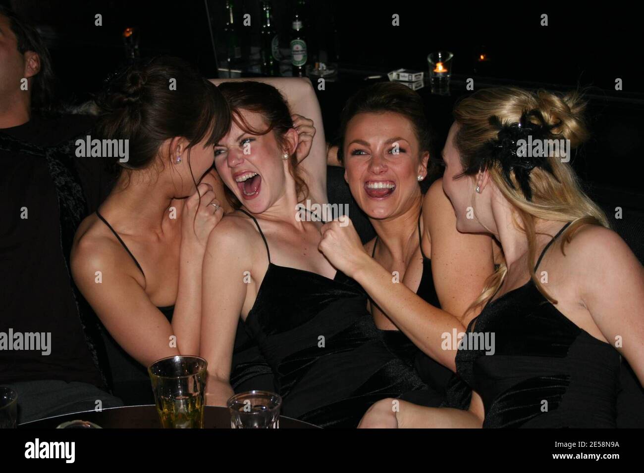 Exclusive!! George Clooney's latest squeeze, American cocktail waitress and  "Fear Factor" winner Sarah Larson likes partying with the girls as seen  here in her promotional modeling days attending the internet gambling  conference