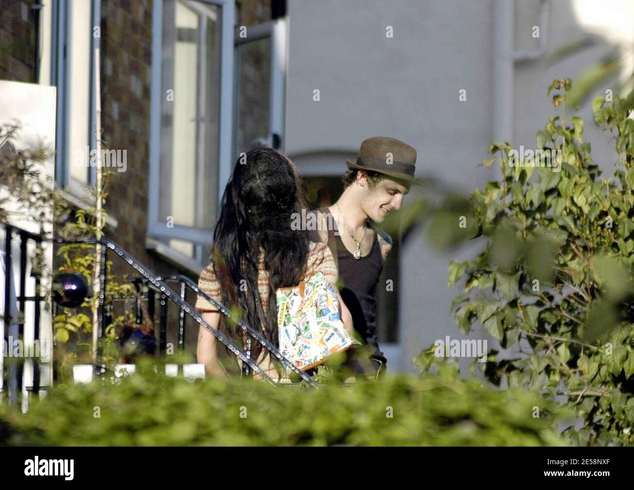 Amy Winehouse kisses husband Blake Fielder-Civil near her North London home. London, UK. 10/4/07.   [[map]] Stock Photo