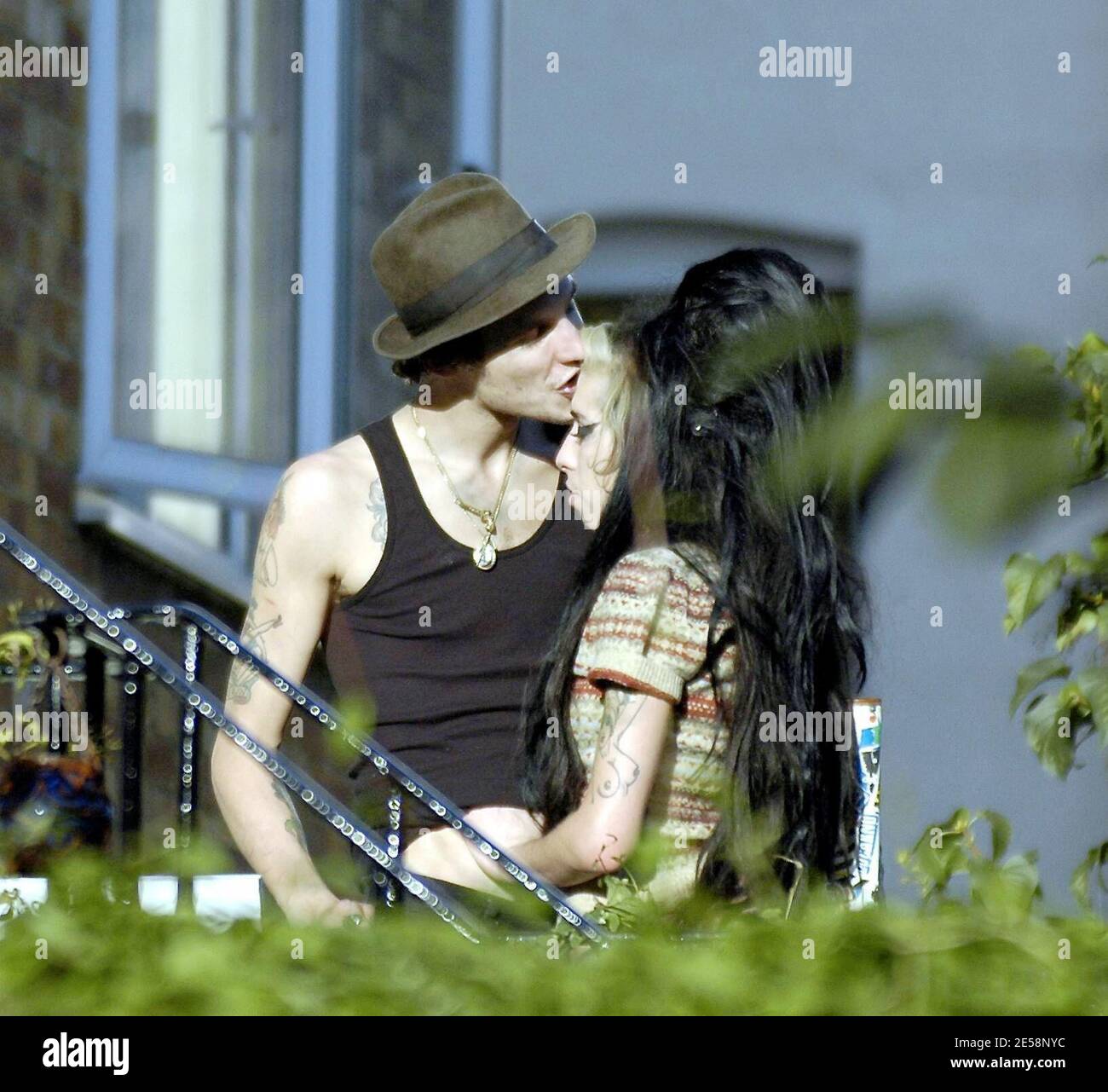 Amy Winehouse kisses husband Blake Fielder-Civil near her North London home. London, UK. 10/4/07.   [[map]] Stock Photo