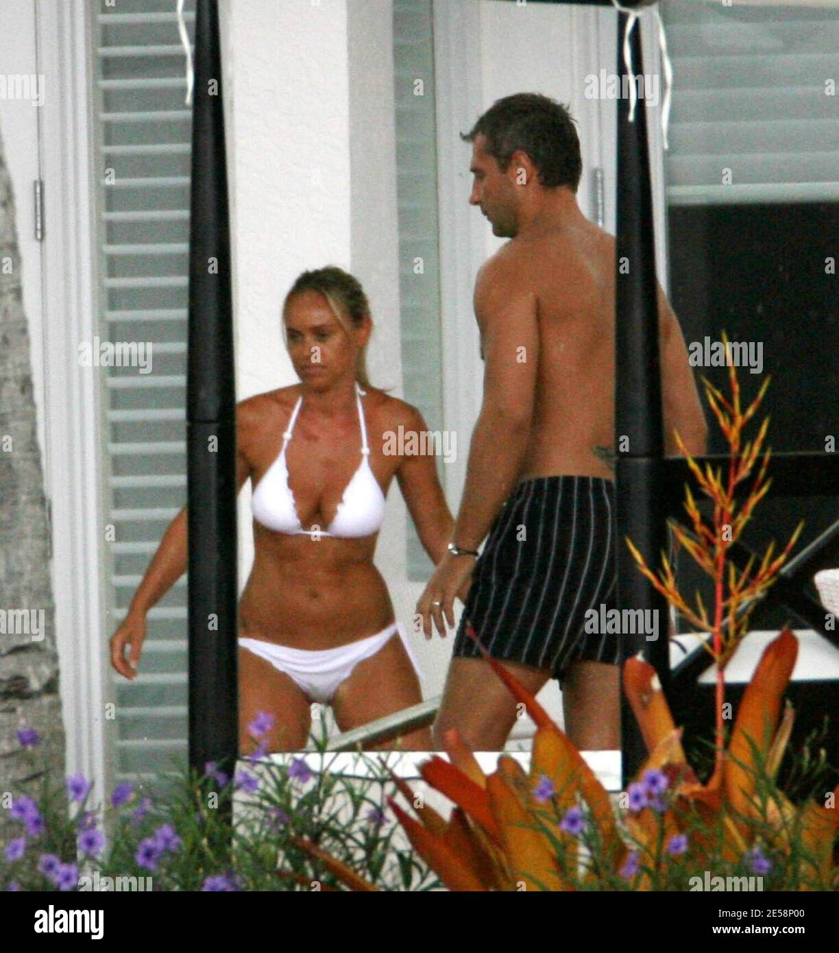 Exclusive!! Cecile de Menibus and Yann Delaigue spend time poolside with  friends at a luxury mansion in Miami Beach, FL. Cecile looked great in a  white bikini and Yan practised his rugby