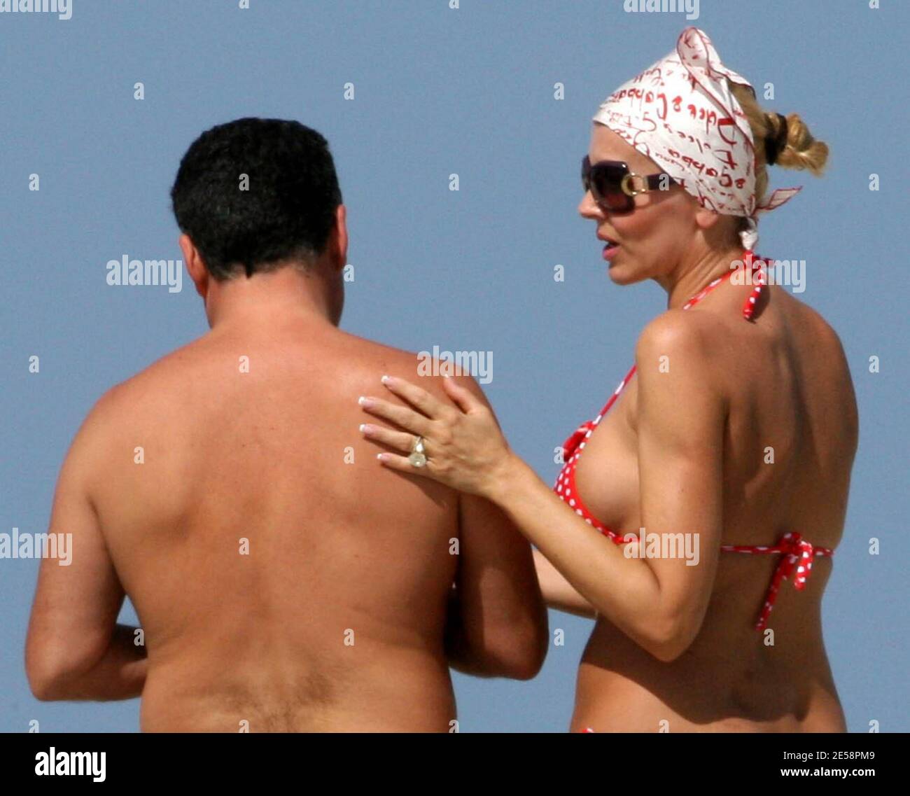 Exclusive!! Canio Mazzaro and girlfriend Rita Rusic spend a second day on  Miami Beach, Fla. Rita was more adventurous this time and bared all to the  Florida sun, 10/8/07. All Stock Photo -