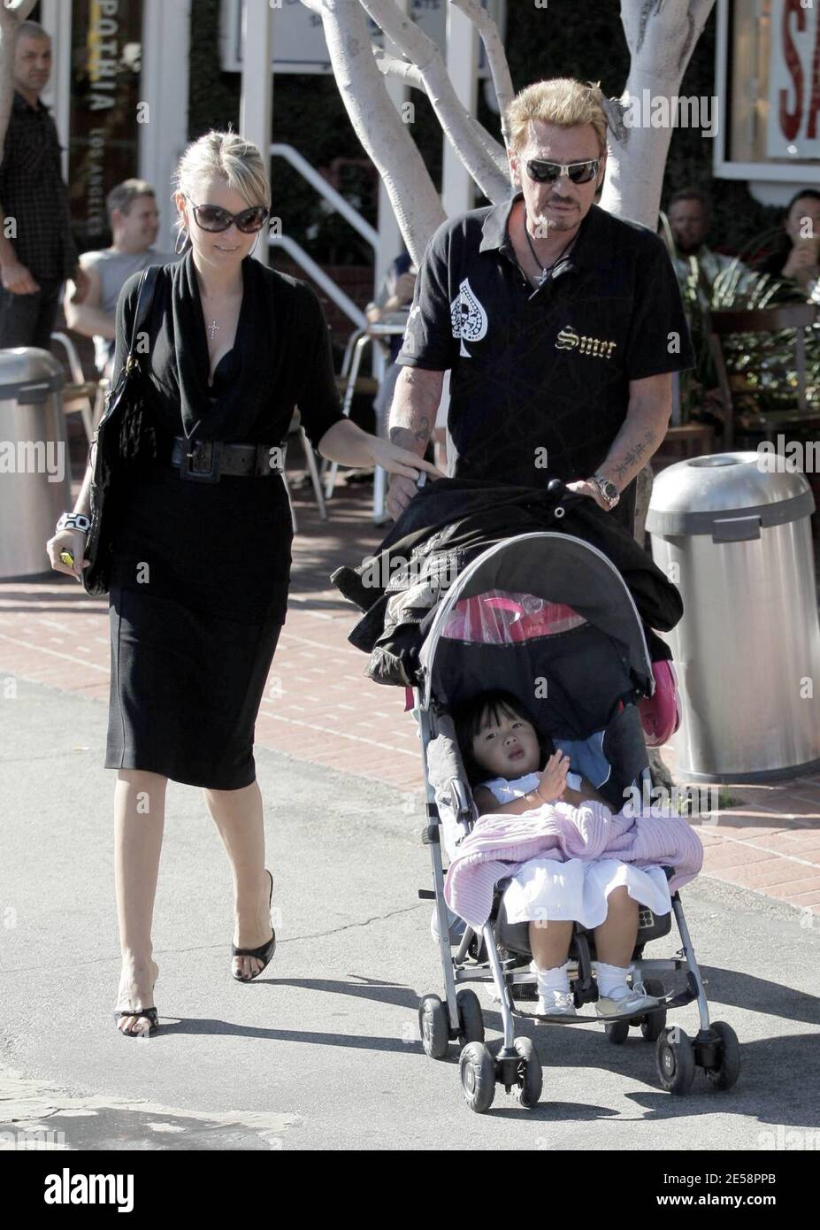 Johnny Hallyday and his wife Laeticia Boudou take adopted daughter Jade