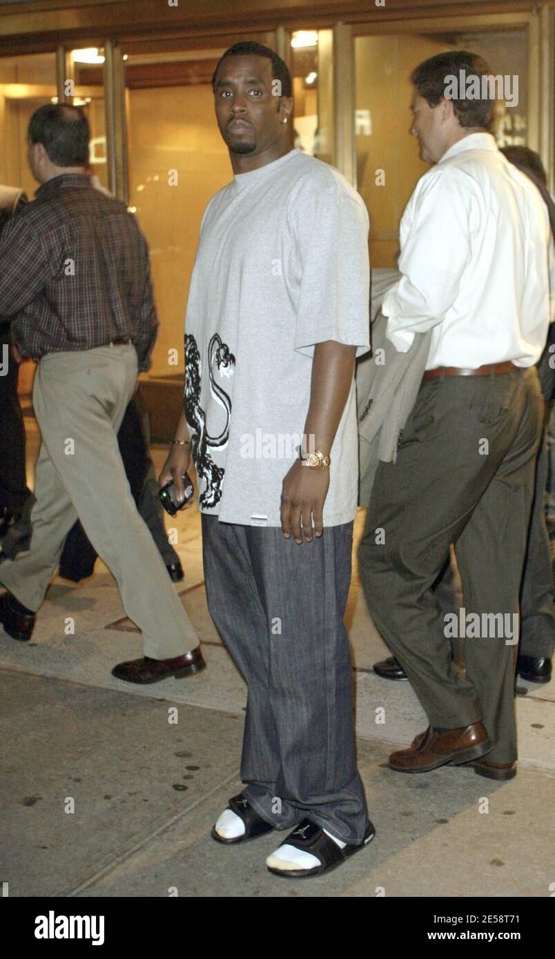 Exclusive!! P Diddy puts in a hard day at the office. Diddy, dressed down  in jeans, flip flops and socks, was spotted leaving his Bad Boy  Entertainment headquarters after dark. New York,