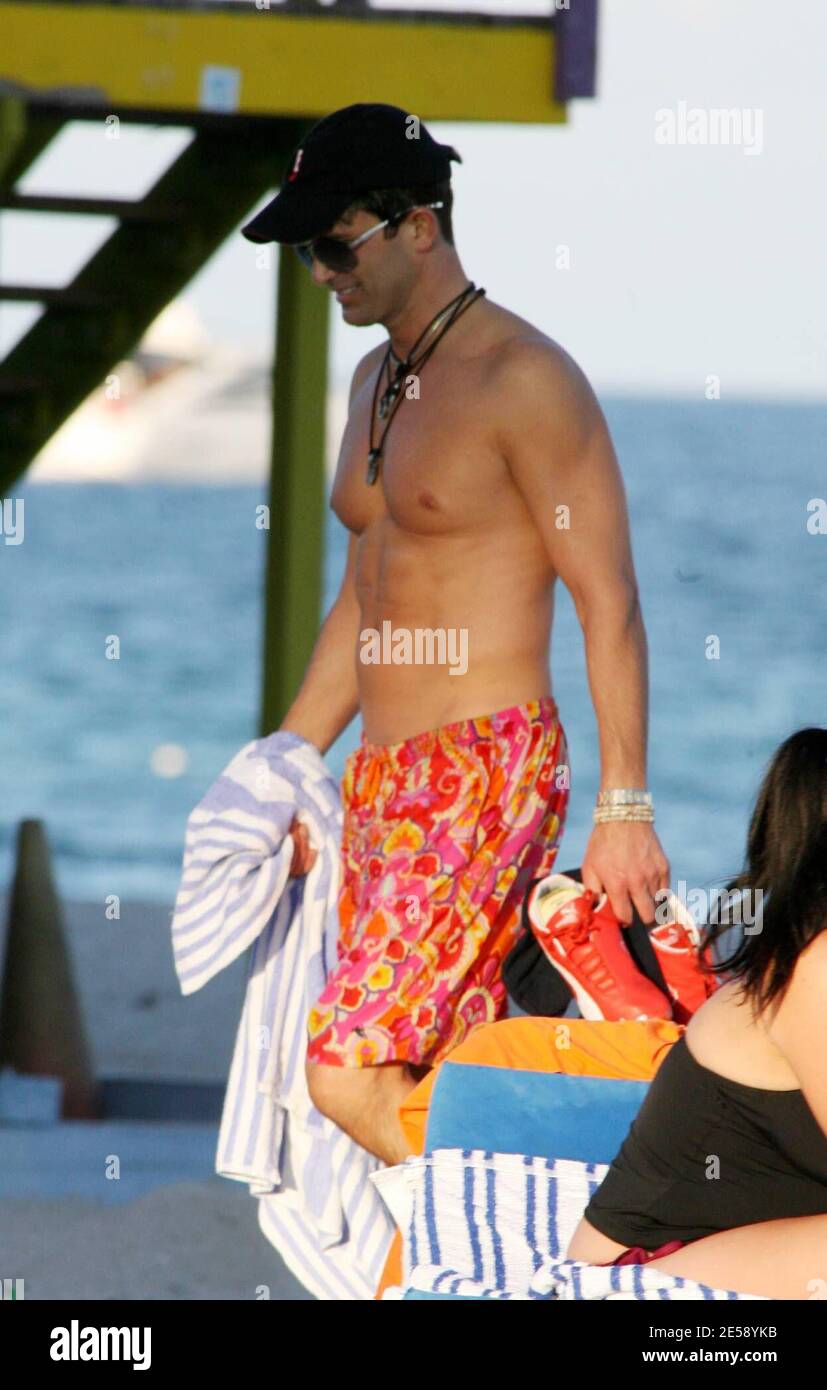Exclusive!! Dr. Robert Rey of E! Entertainment's "Dr. 90210" shows off his  hard body in the sun on Miami Beach and poses for photographs with fans. He  is in town to launch
