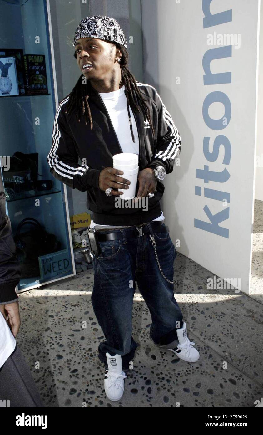 Rap star Lil Wayne shopped at Kitson's Men in West Hollywood before posing  with female fans outside. When asked what projects he was working on he  quickly replied, "Women!" and flashed his "