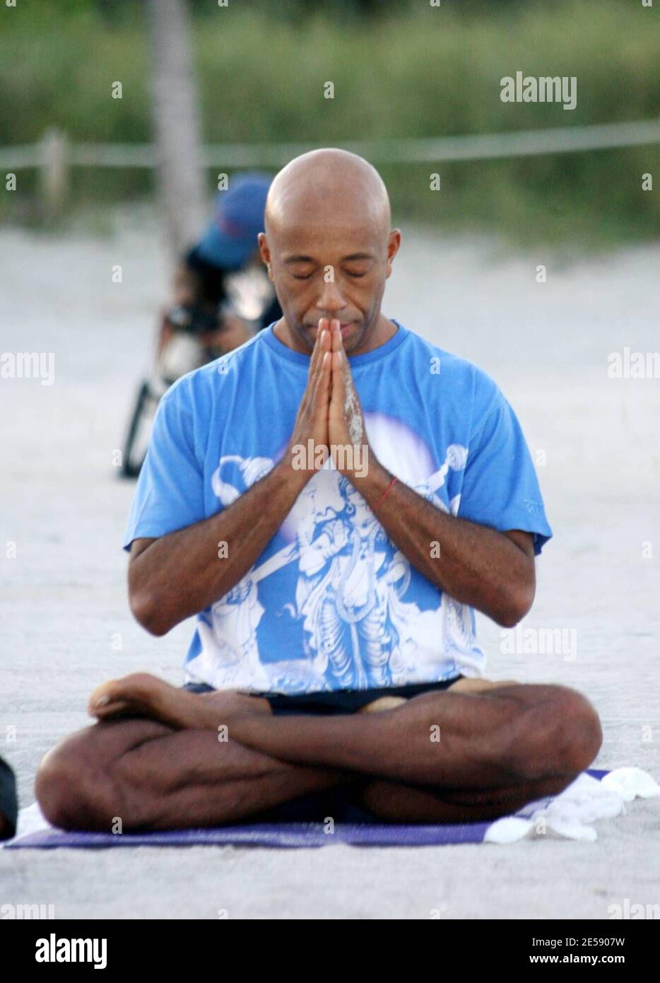 hip-hop-mogul-russell-simmons-does-yoga-class-on-miami-beach-with-his-new-girlfriend-model-porschla-coleman-miami-beach-fl-12407-mab-2E5907W.jpg