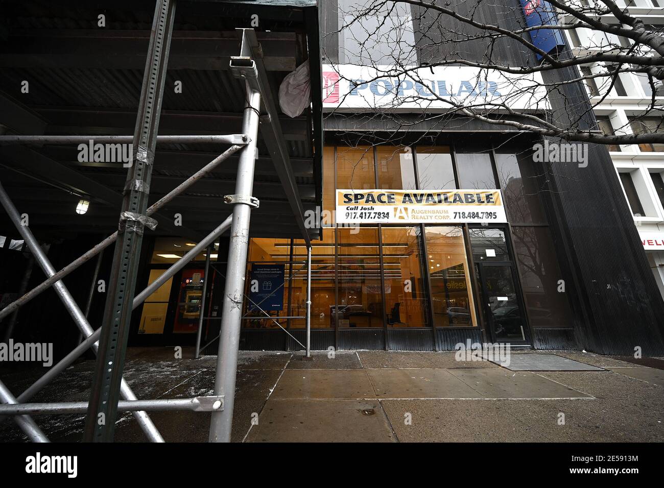 New York, USA. 26th Jan, 2021. Exterior view of a permanently closed Banco Popular bank branch along 125th Street in the Harlem neighborhood of Manhattan, New York, NY, January 26, 2021. African American communities have been disproportionately affected by COVID-19 infections at a rate of 3 times higher than white communities, impacting heavily on their business and communities. (Photo by Anthony Behar/Sipa USA) Credit: Sipa USA/Alamy Live News Stock Photo