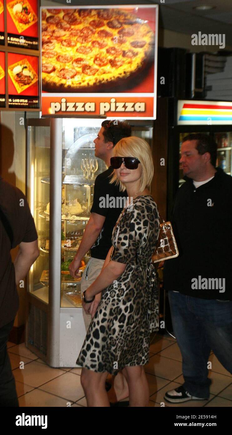Self confessed shopaholic Paris Hilton hit trendy Miami Beach store Atrium and showed off more than she meant to before dropping $20,000 in less than an hour on designer goods.  The Hilton heiress bought jeans, dresses, t-shirts, boots and shoes that would  make Imelda Marcos jealous.  Paris then walked a few doors away to visit her favorite local Kebab restaurant and caused quite a stir whilst her chauffeured SUV was driven back to her hotel chock full of Atrium bags.  Miami, FL,12/8/07.   [[tag]] Stock Photo