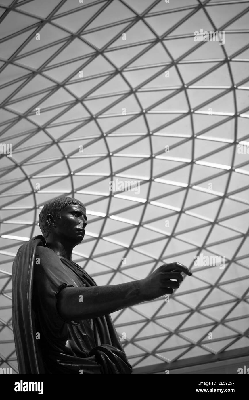 Roman Statue of Caesar, under the glass ceiling of the British Museum Stock Photo