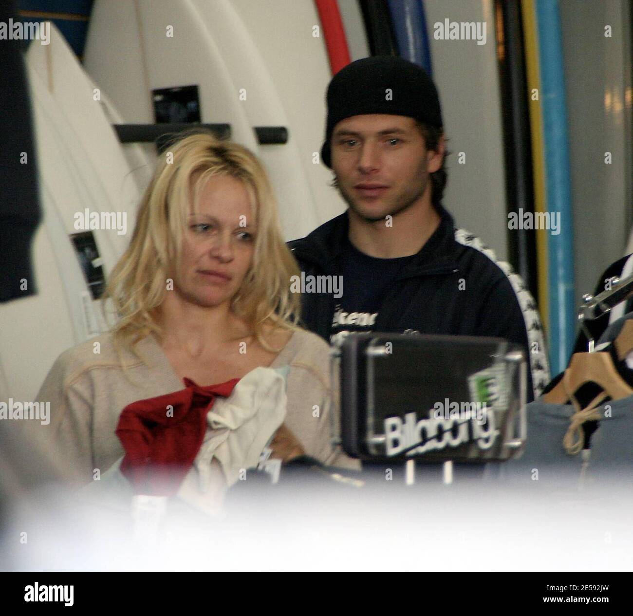 Exclusive!! Pamela Anderson and her husband Rick Salomon go Christmas  shopping for the kids at a surfing store near Anderson's home. The actress  was still without a wedding ring and was dressed