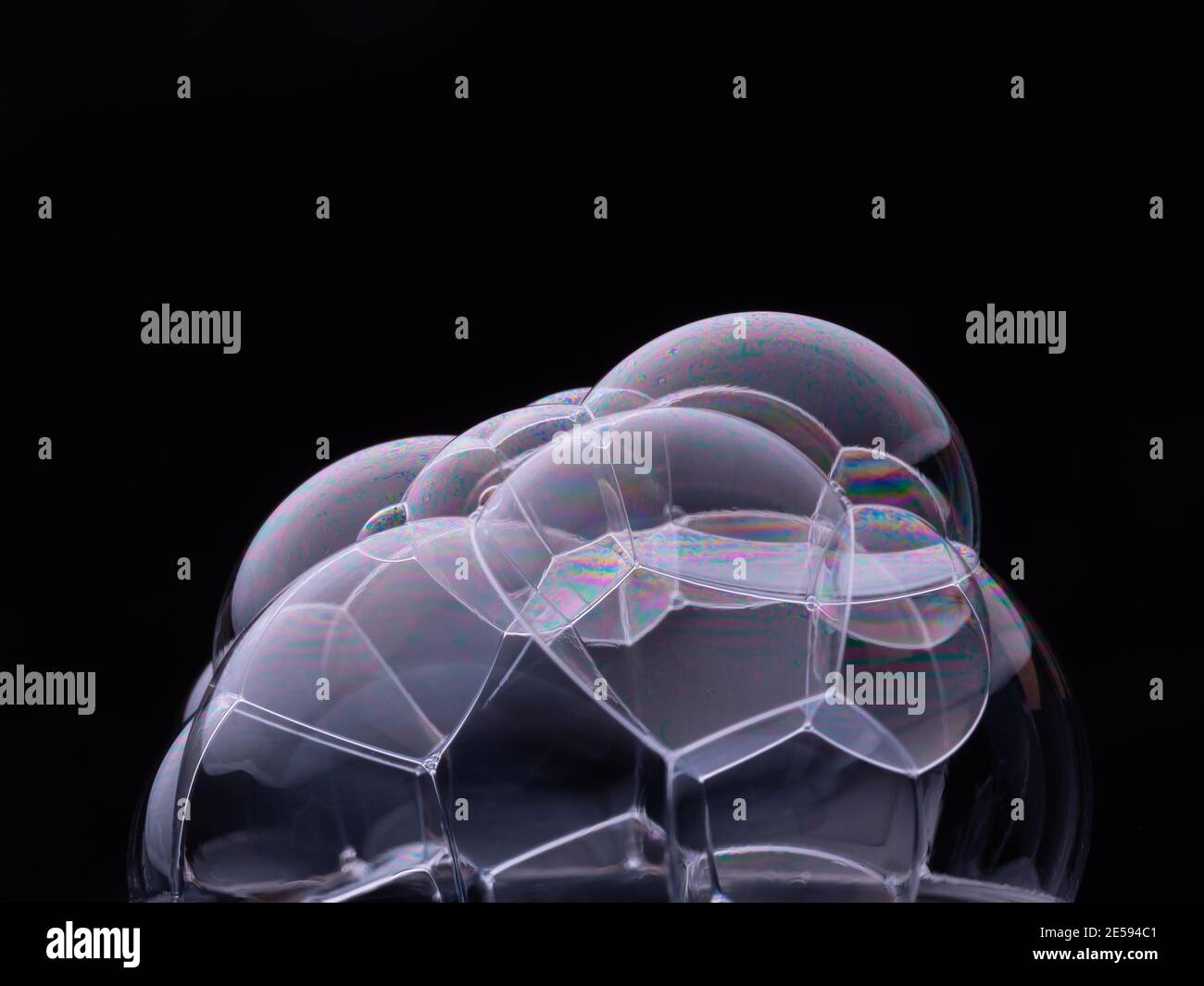 Soap bubbles isolated on black background. Macro shot Stock Photo