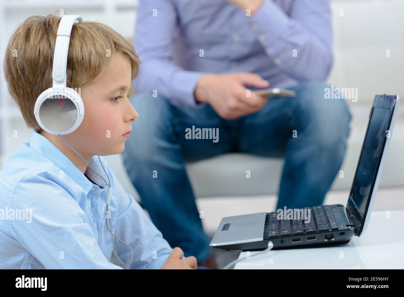 Young boy with a laptop Stock Photo
