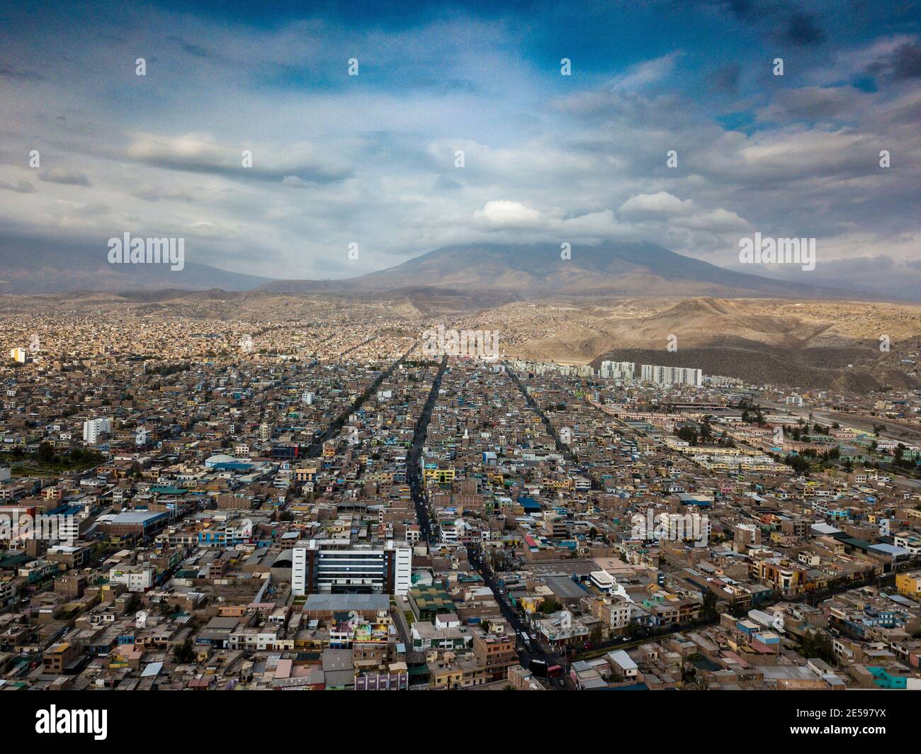 Aerial view of Arequipa city in Peru. Taken with the drone, a panoramic cityscape scene with buildings and houses and the Misti volcano. Stock Photo
