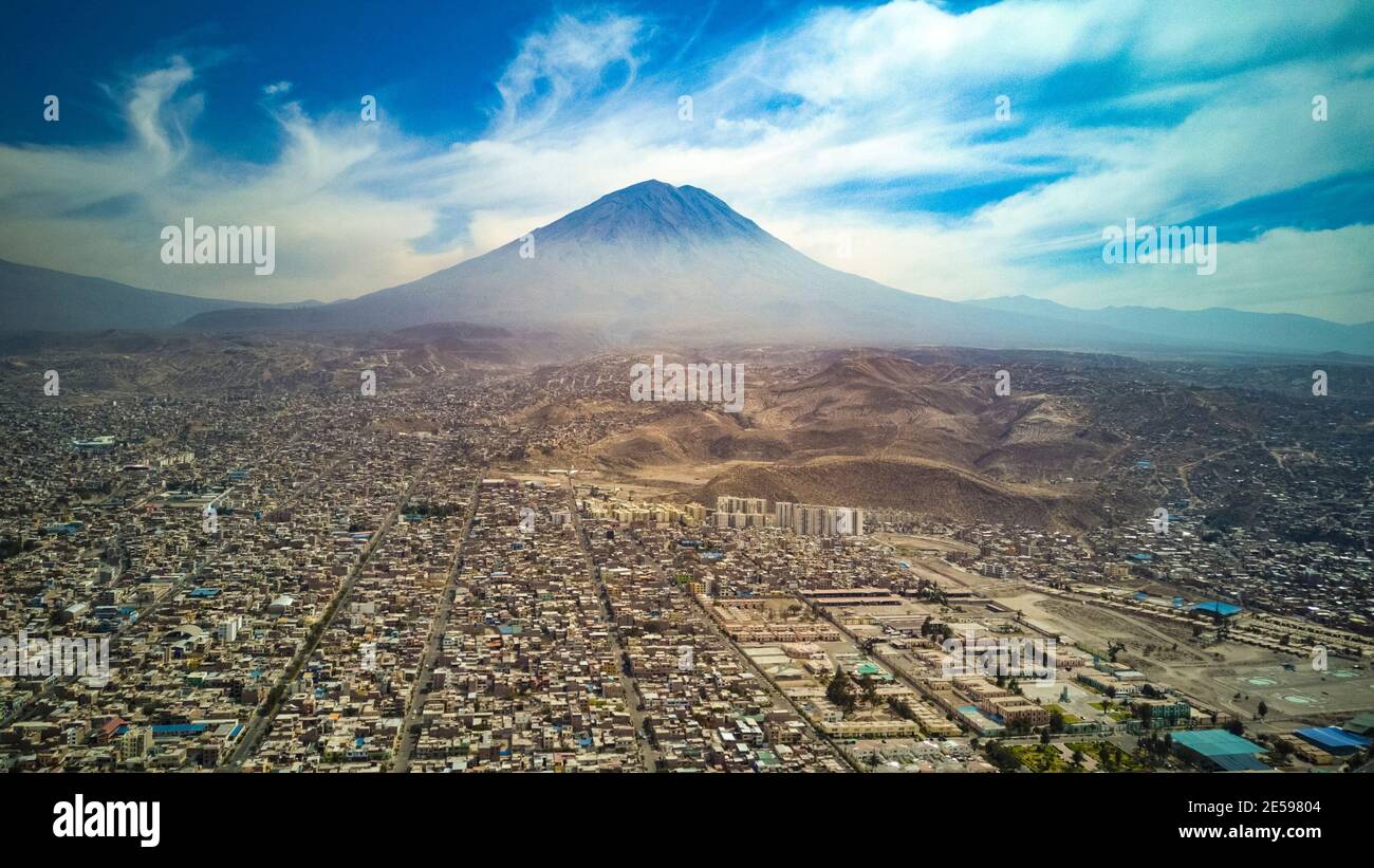 Aerial view of Arequipa city in Peru. Taken with the drone, a panoramic cityscape scene with buildings and houses and the Misti volcano. Stock Photo