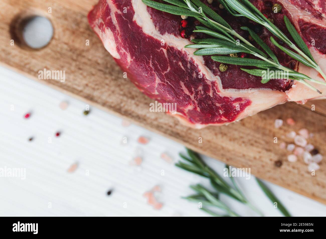 Raw fresh meat steak on cutting board. Copy space. Top view Stock Photo by  annapustynnikova