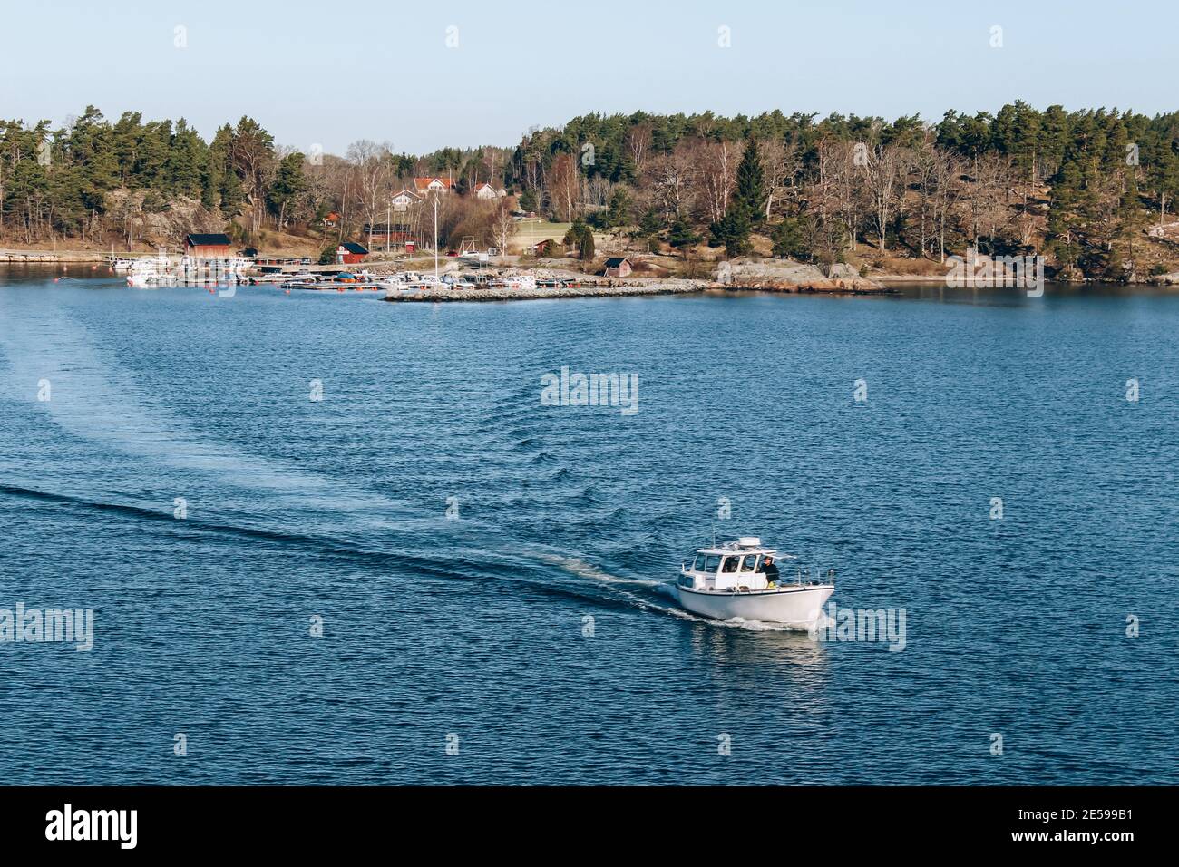 Stockholm, Sweden - May 1, 2019 : Baltic sea landscape, small boat near shore line. Local privat transport, tourism concept, spring nature, selective Stock Photo