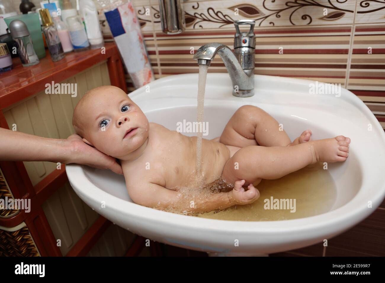 Mother Bathing Baby Boy High Resolution Stock Photography And Images Alamy