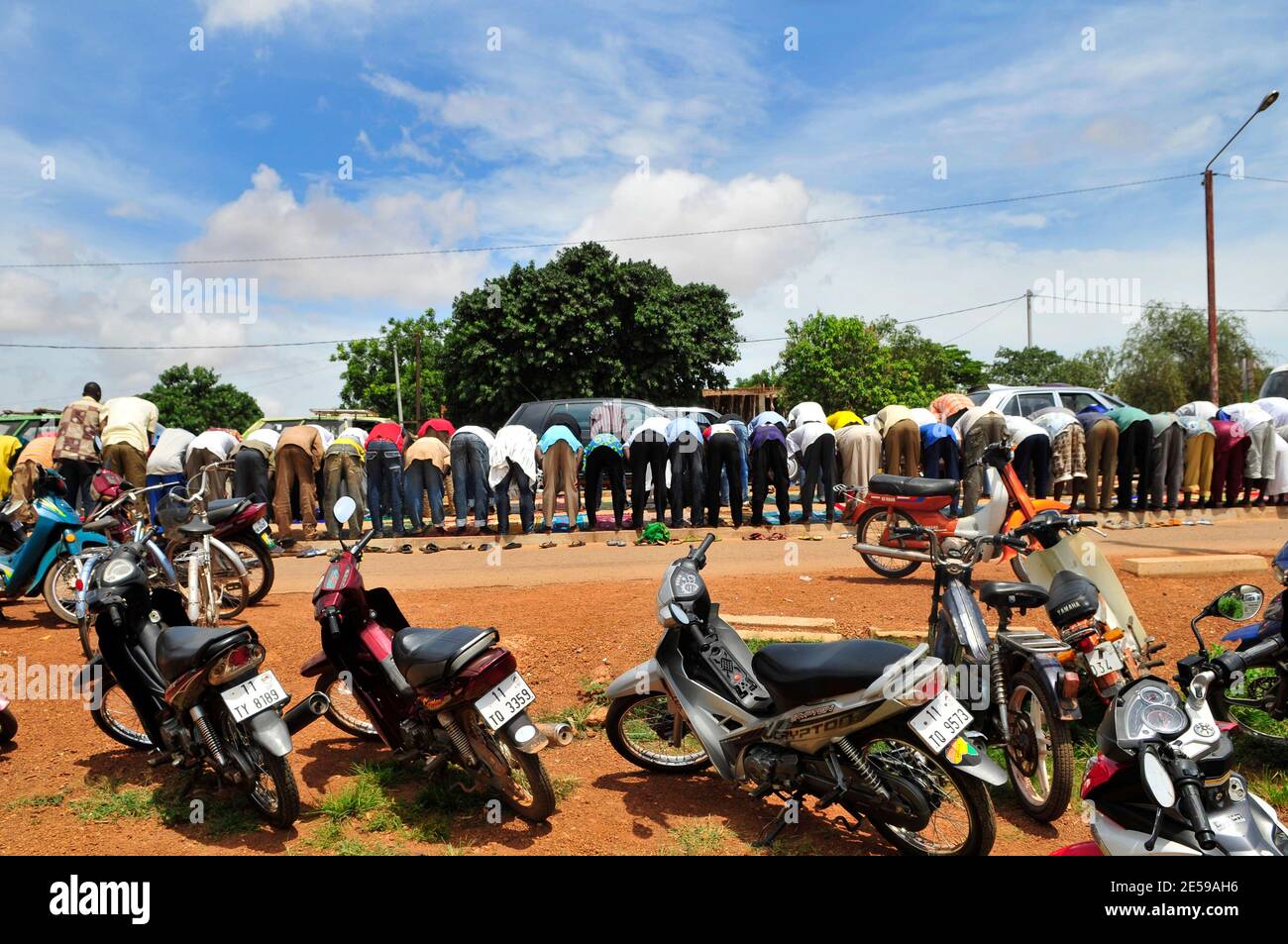 Friday prayers in the middle of the road in Ouagadougou, Burkina Faso. Stock Photo