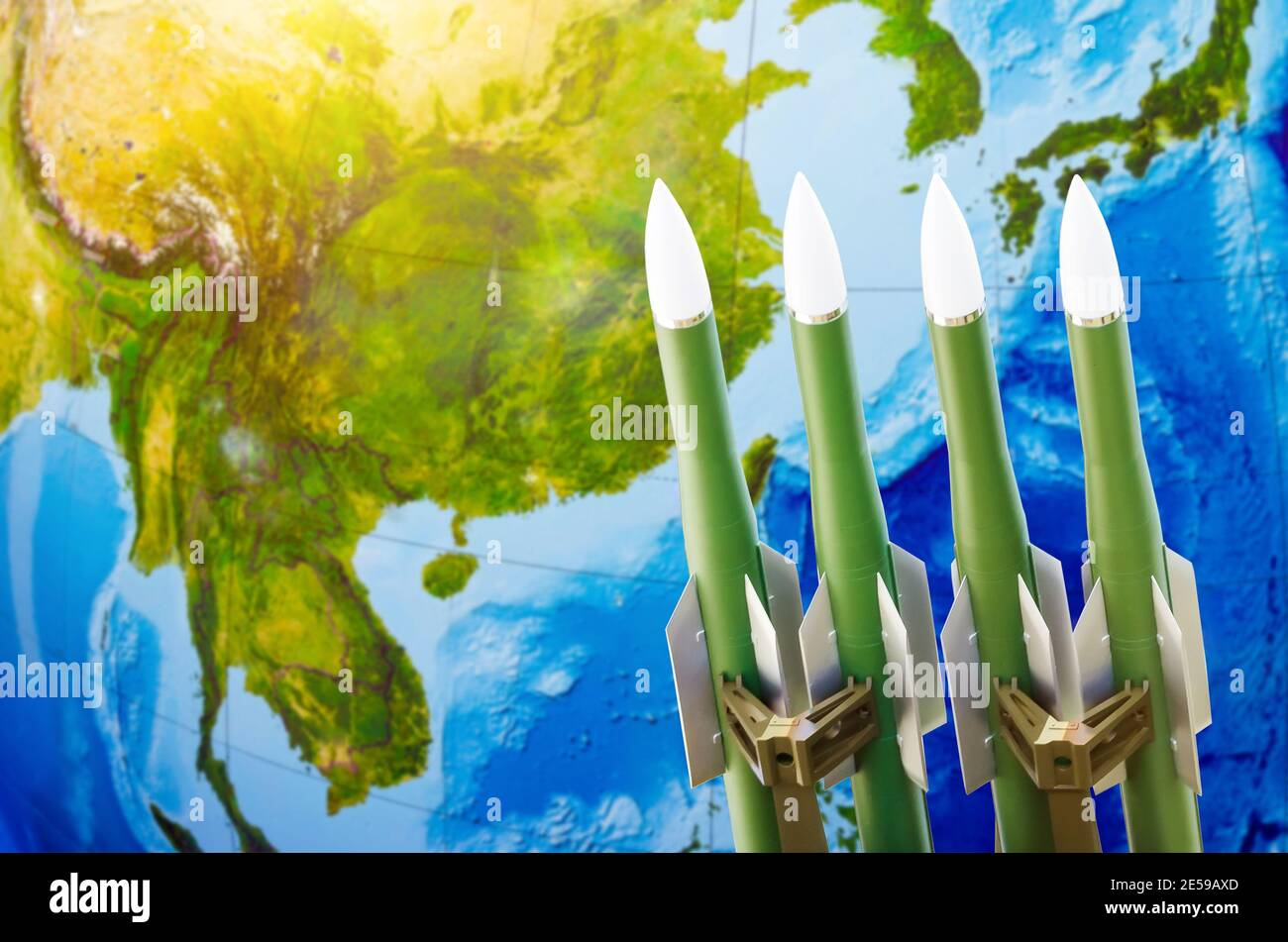 Race of weapons, nuclear weapons, the threat of war in the world. Rockets on the background of Asia- China, Japan, Korea Stock Photo