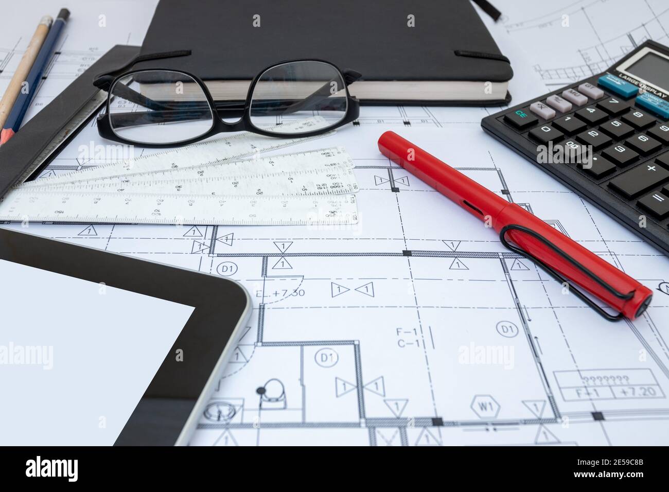 architect design working drawing sketch plans blueprints in architect studio Stock Photo