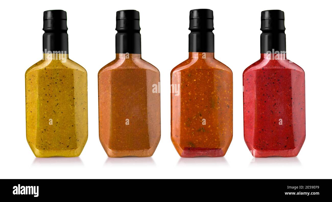 barbecue sauces in glass bottles isolated on white background Stock