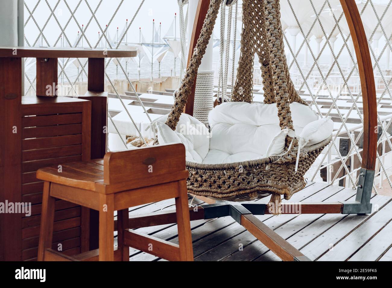 Woven swing on luxury hotel terrace near sea Stock Photo - Alamy