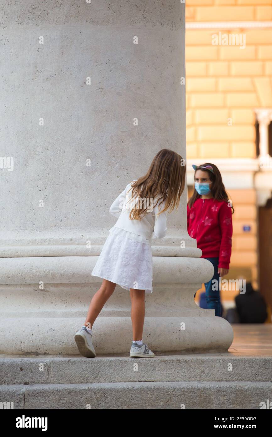 File:Portugal (Lisbon) Beautiful little girl playing Hide and Seek game  (35739006586).jpg - Wikimedia Commons