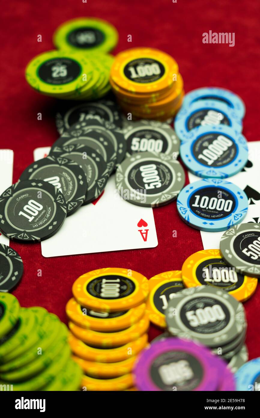 High Stakes Texas Hold Em Poker Game On Red Felt At The Casino Stock Photo Alamy