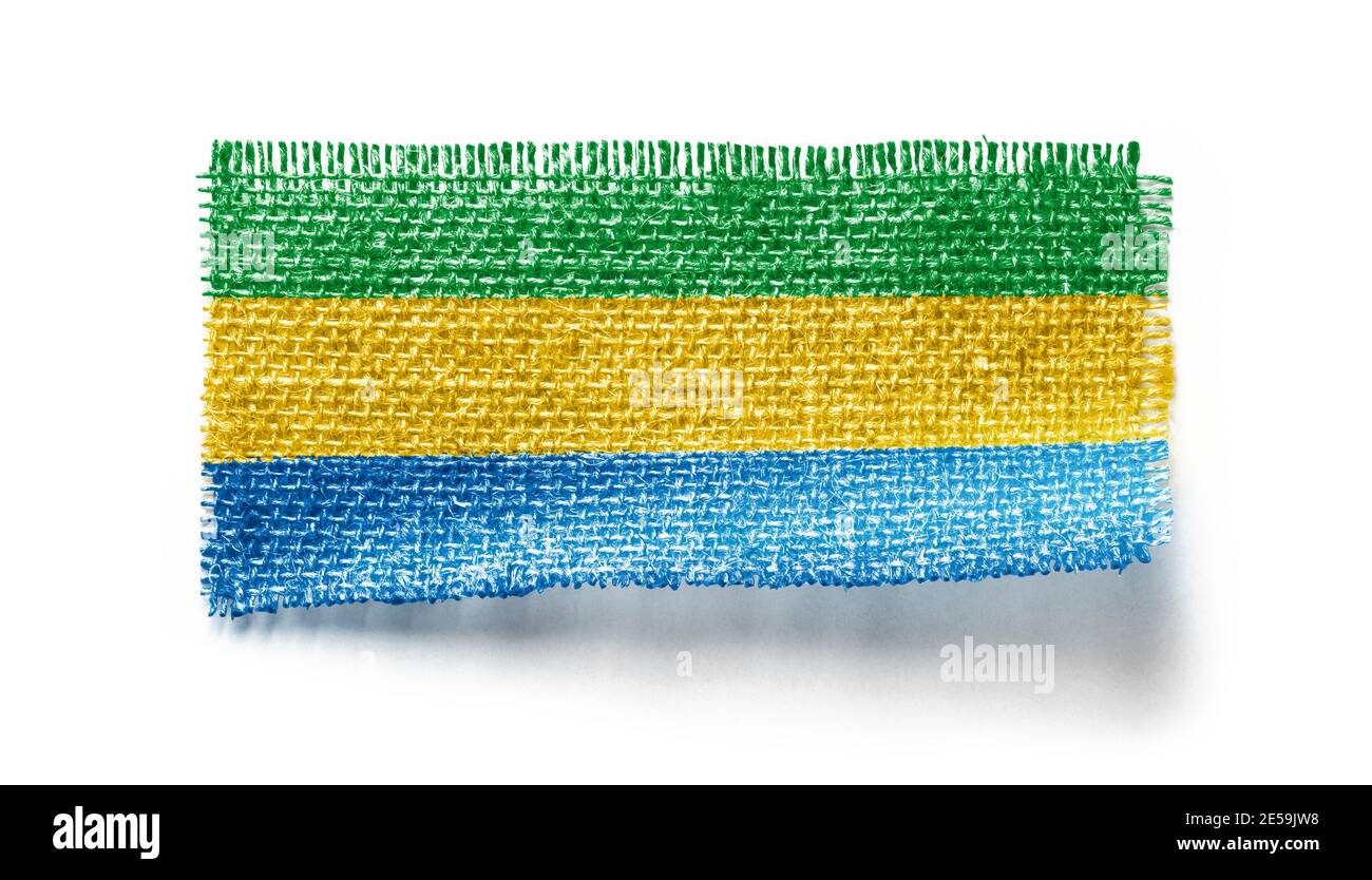 Gabon flag on a piece of cloth on a white background Stock Photo - Alamy