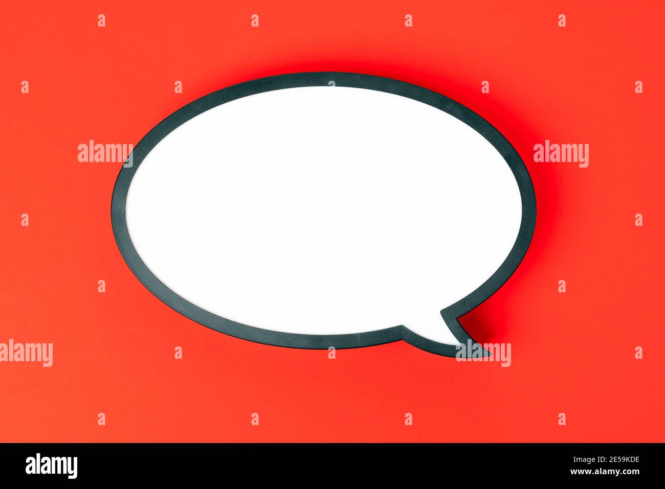 Blank speech bubble isolated on red background. Nobody Stock Photo