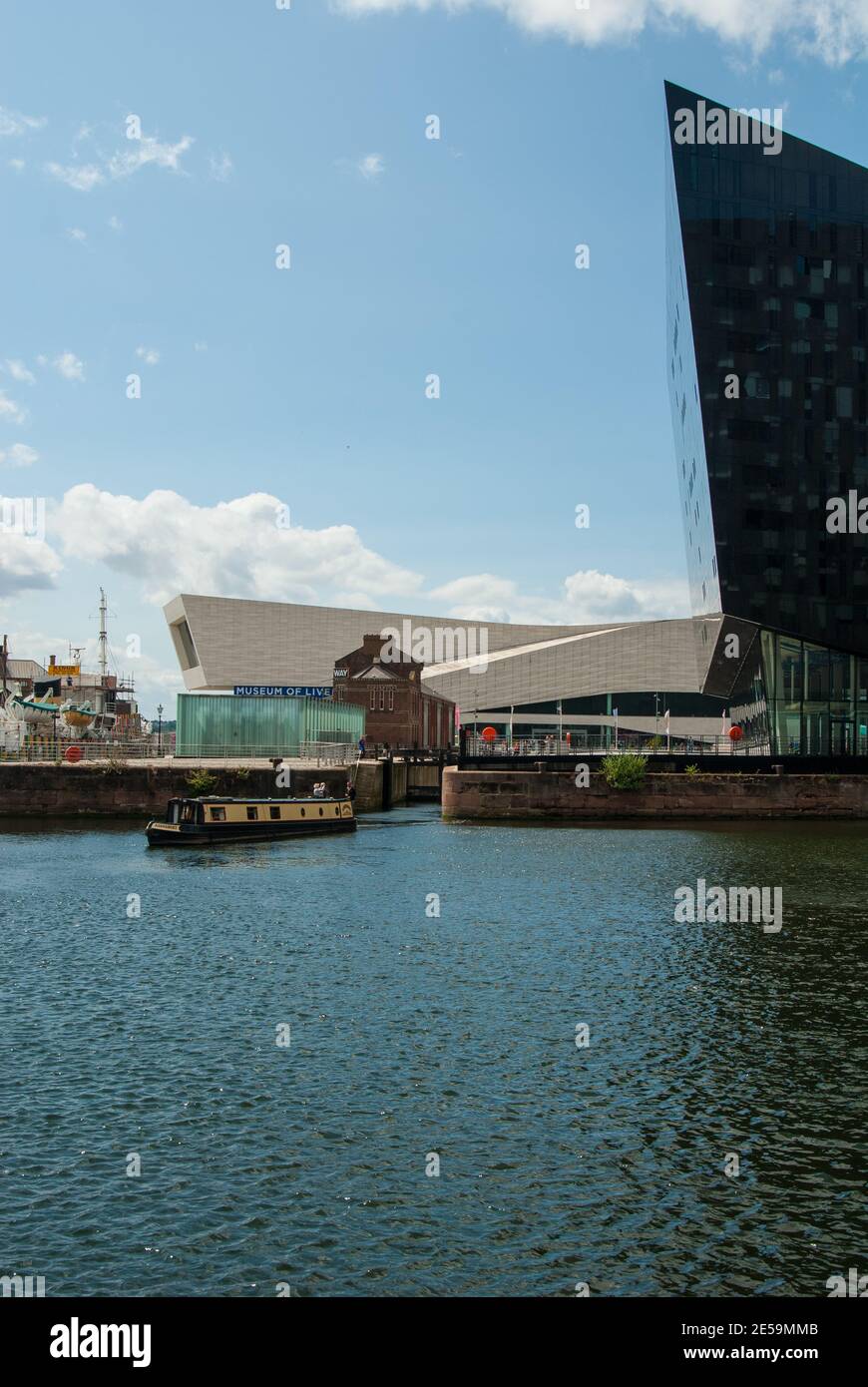 A barge coming through the lock on the waterfront in Liverpool England UK Stock Photo