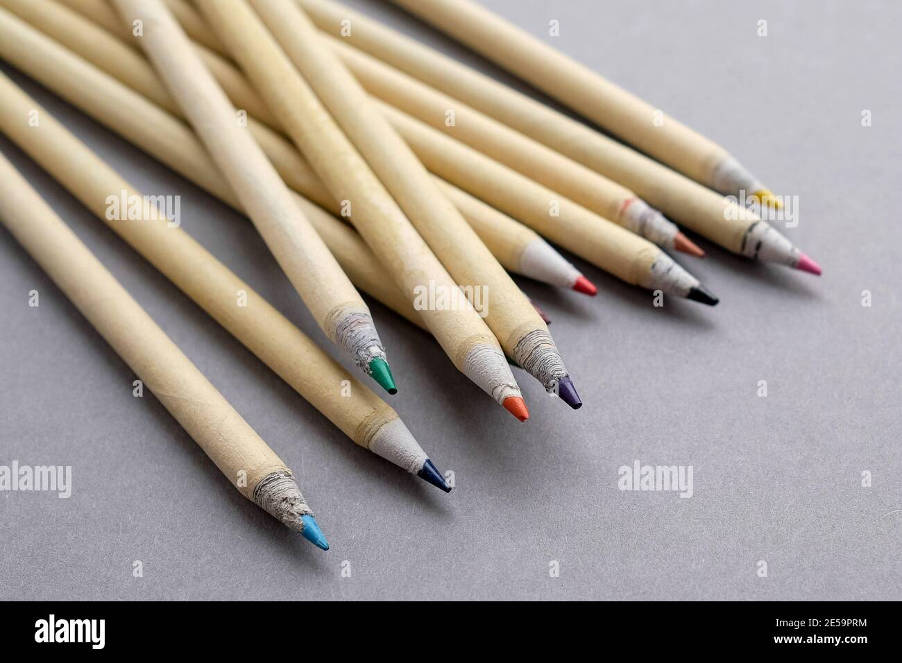 Eco-friendly pencils. Colored pencils for drawing. Grey background. Stock Photo