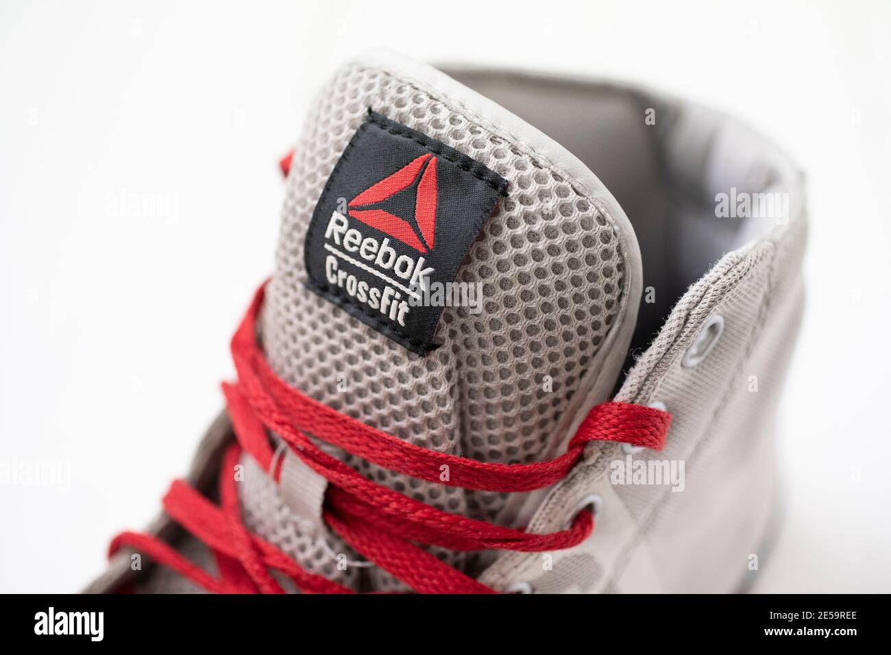 Reebok Crossfit TR Lite training shoes on a white wooden floor Stock Photo