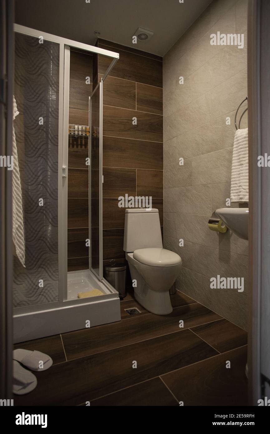 Modern bathroom interior with minimalistic shower and lighting, white ...
