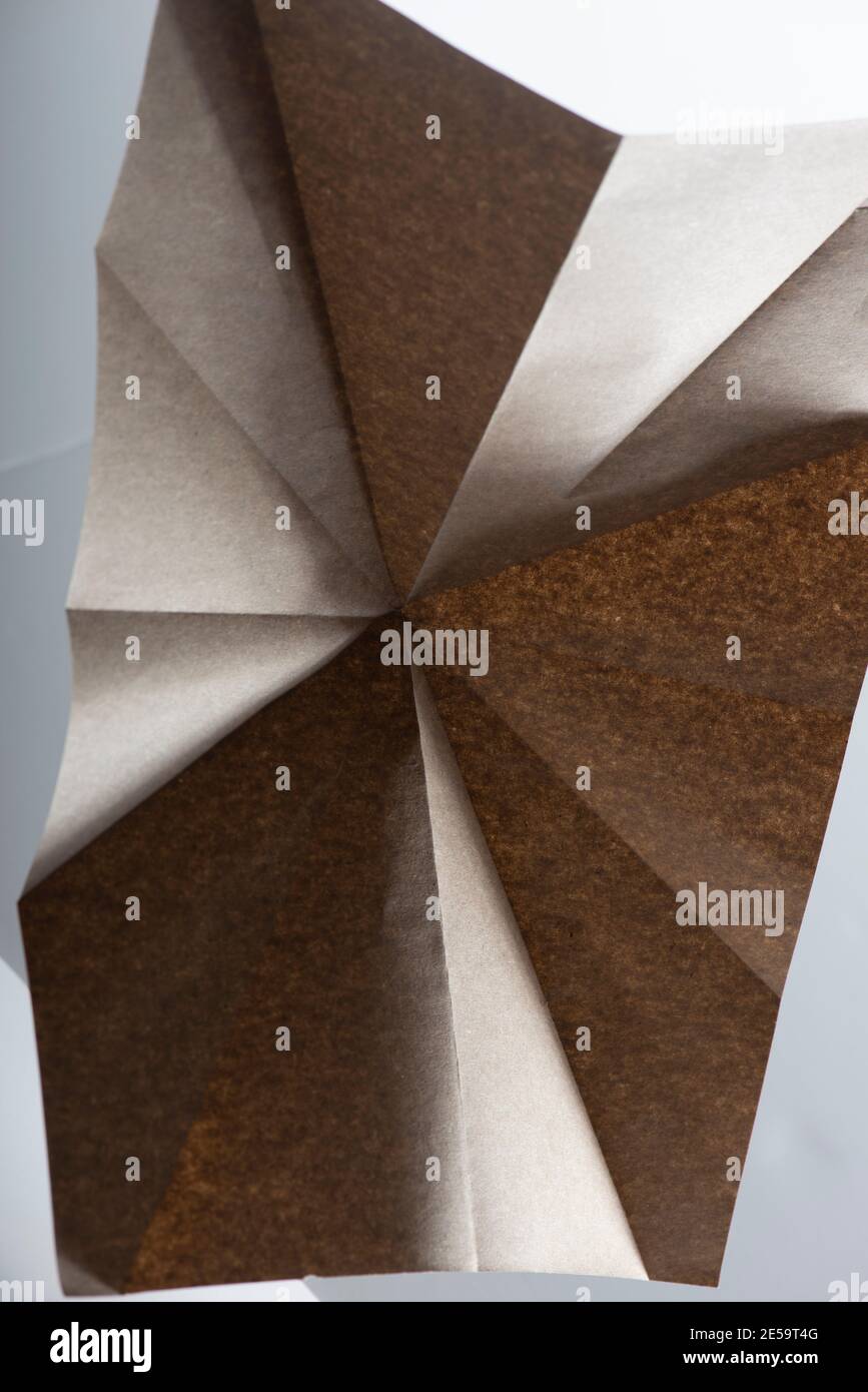 Beige paper geometry composition. Abstract background. Macro shot. Copy space. Stock Photo